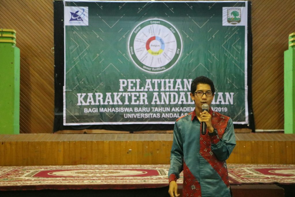 a man standing in front of a microphone